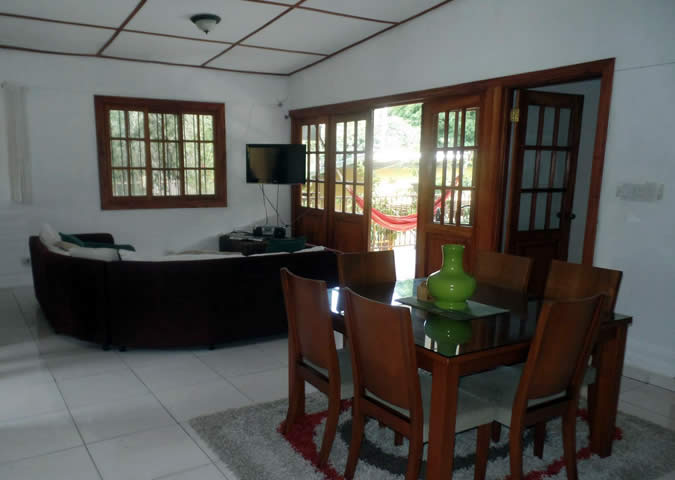 Living and dining room area at Gaia Hostel